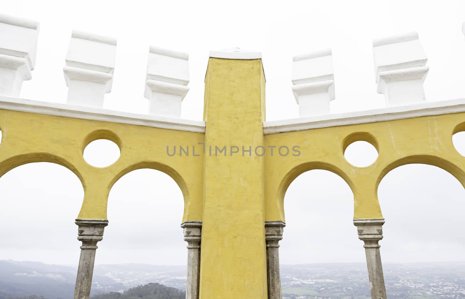 Ancient yellow arches in the Pena Palace, detail of ancient architecture, heritage of humanity, tourism