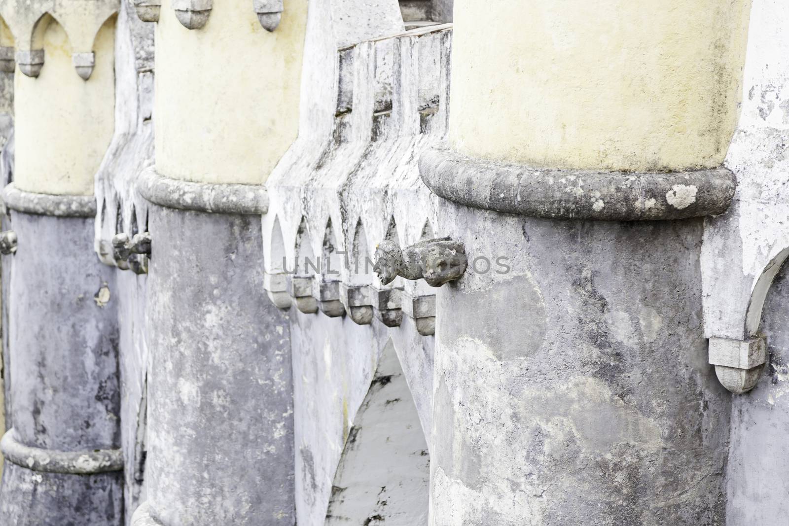 Gargoyle in Sintra Pena Palace, detail of an old heritage of humanity building, tourism in Portugal