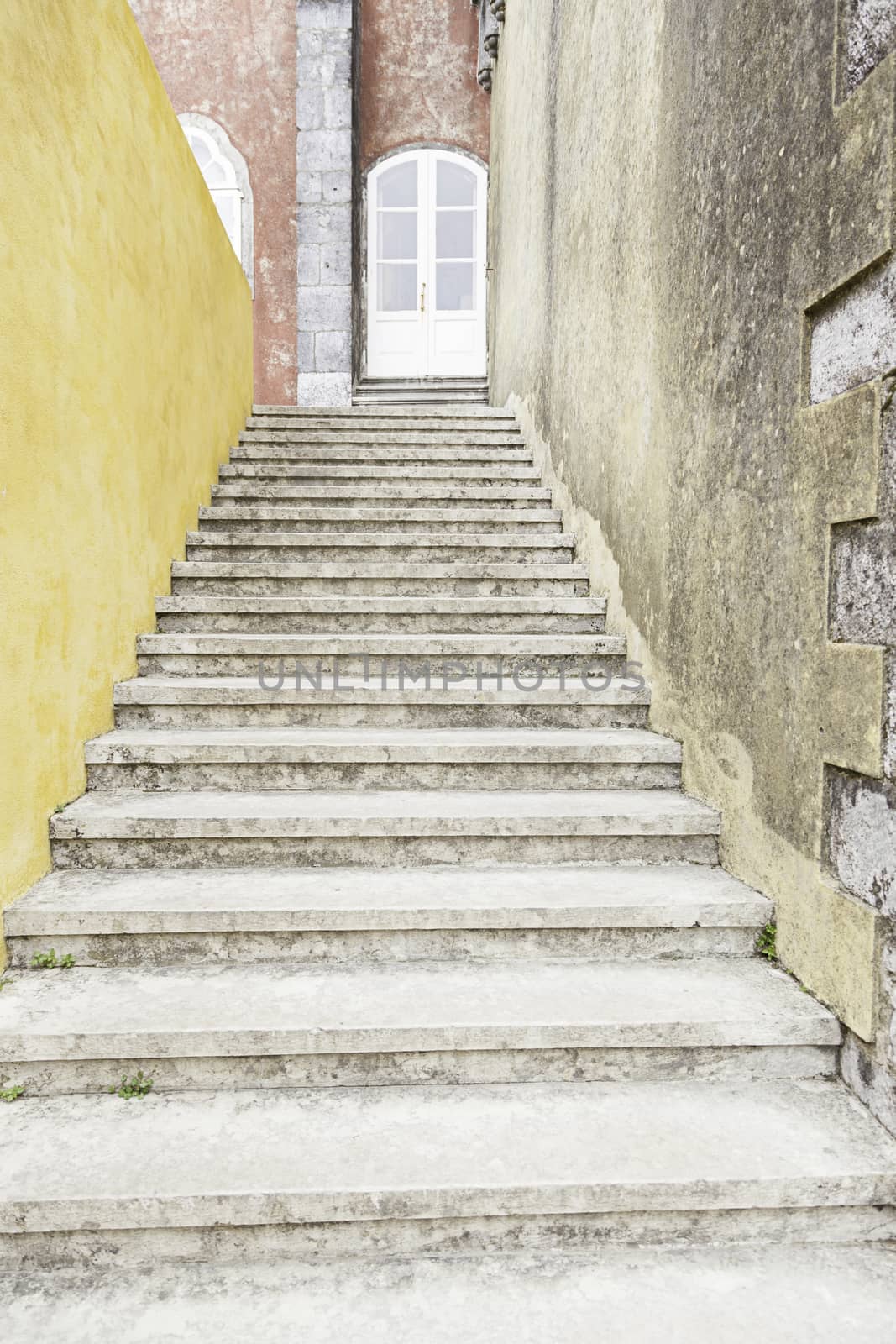 Old stone stairs in the town of Sintra, detail of a stairs to a house in Portugal
