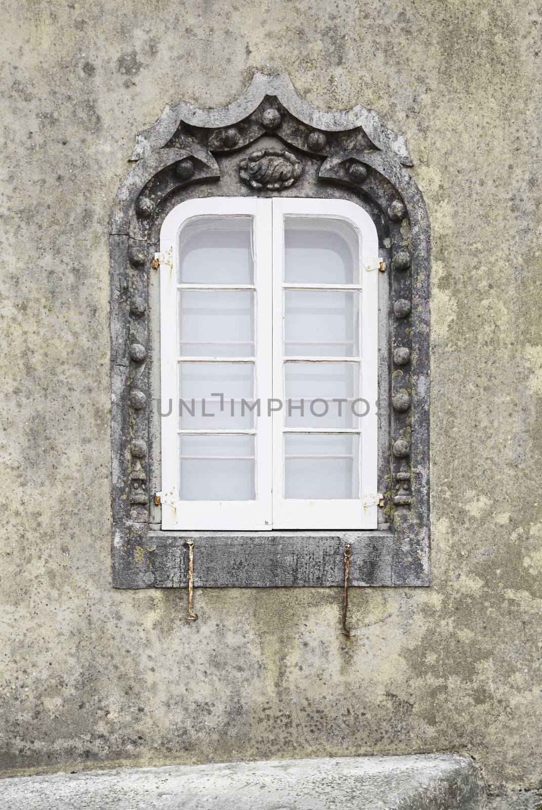 Old facade with typical tiles from Lisbon, detail of a decorated wall, typical architecture of Portugal