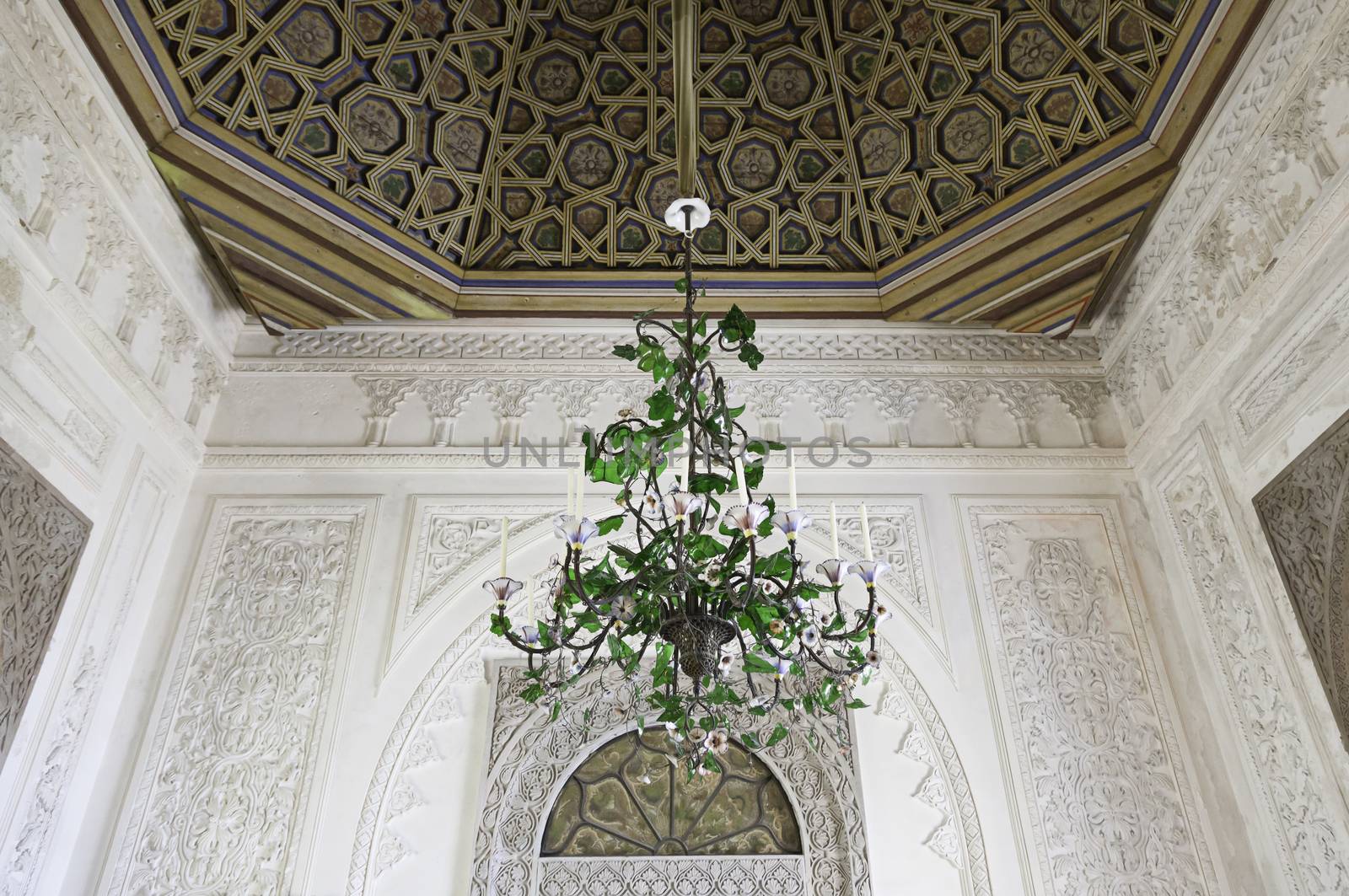 Old lamp chandelier, detail of a bronze lamp inside a castle, ancient art