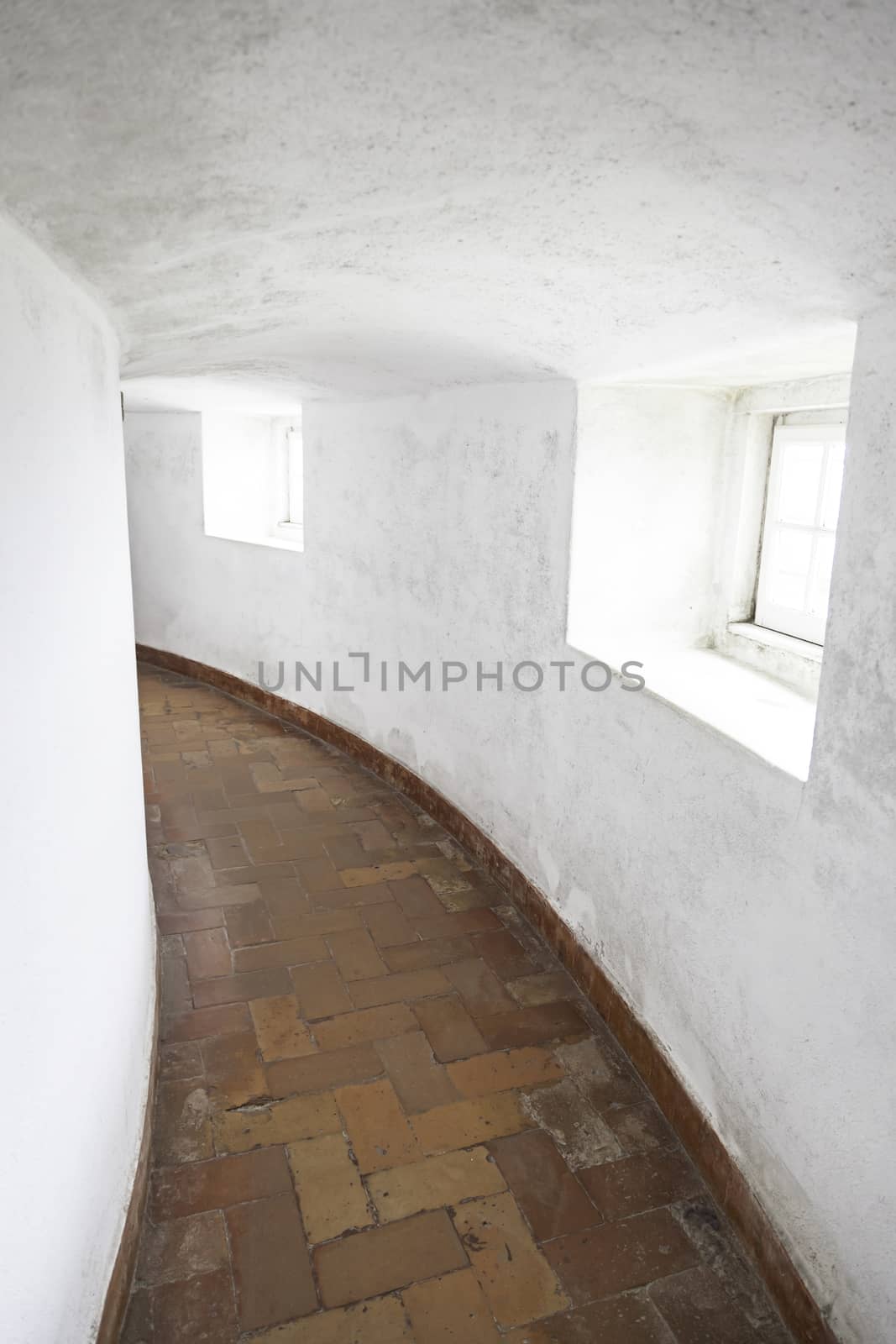 Old corridor with windows, detail of a hall in ancient catacombs