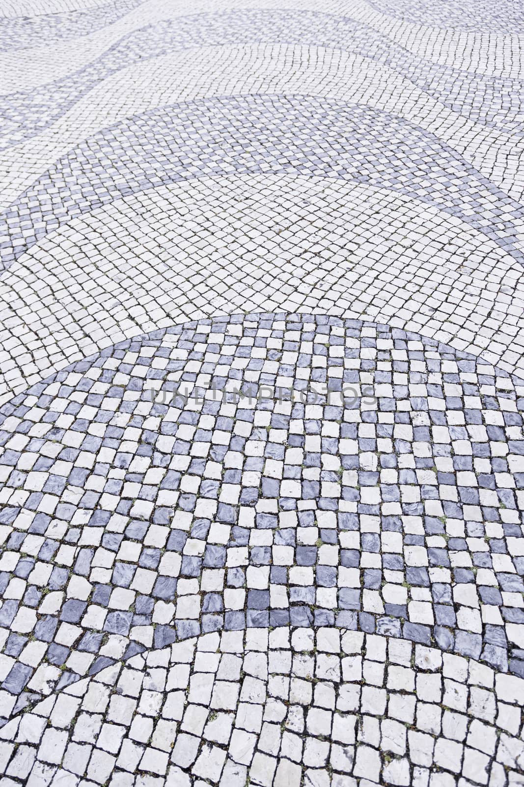 Typical stone floor Lisbon, detail of a typical floor with shapes and drawings, art Portugal, tourism