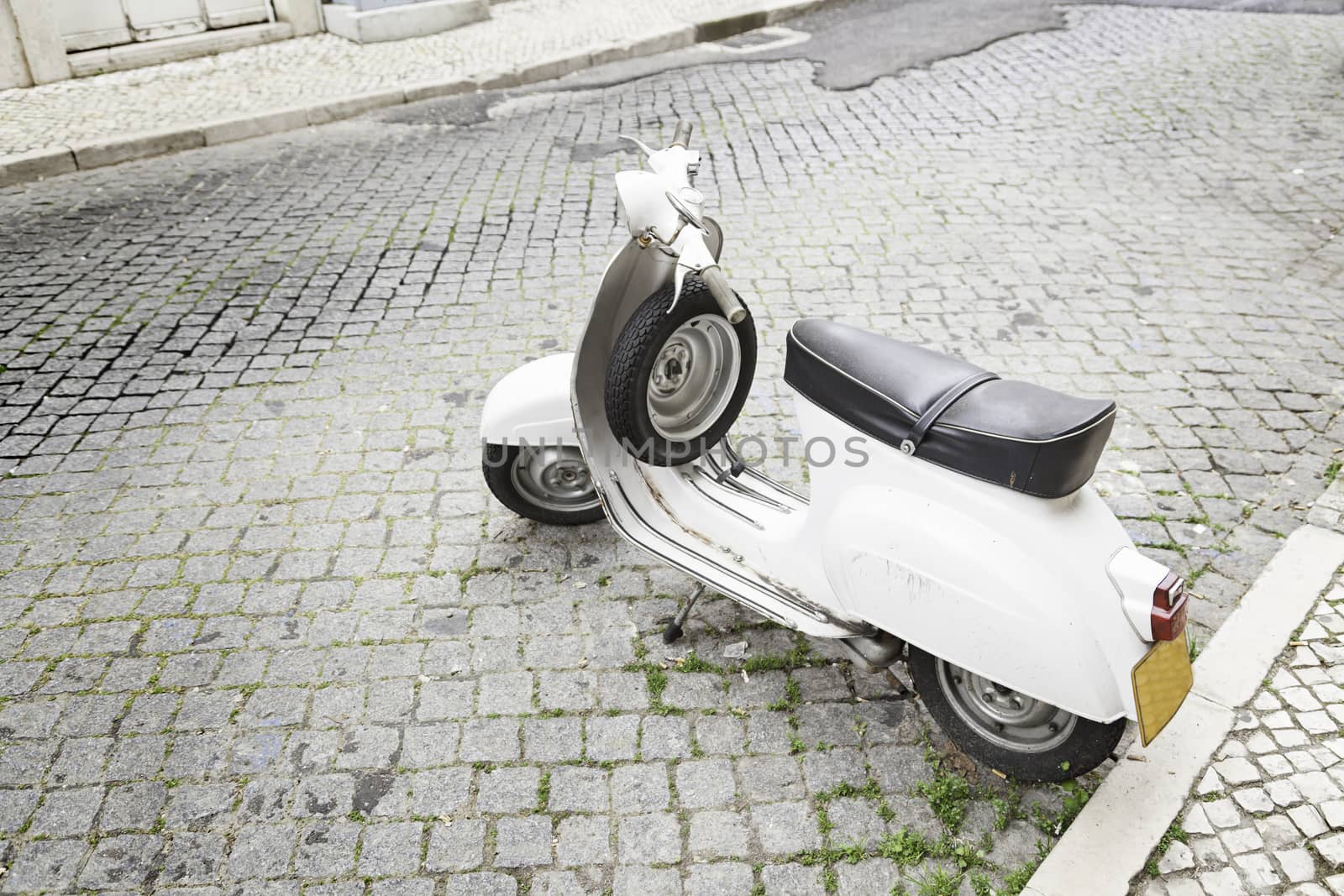 Old motorcycle in the city, detail of transportation to the city, public transport