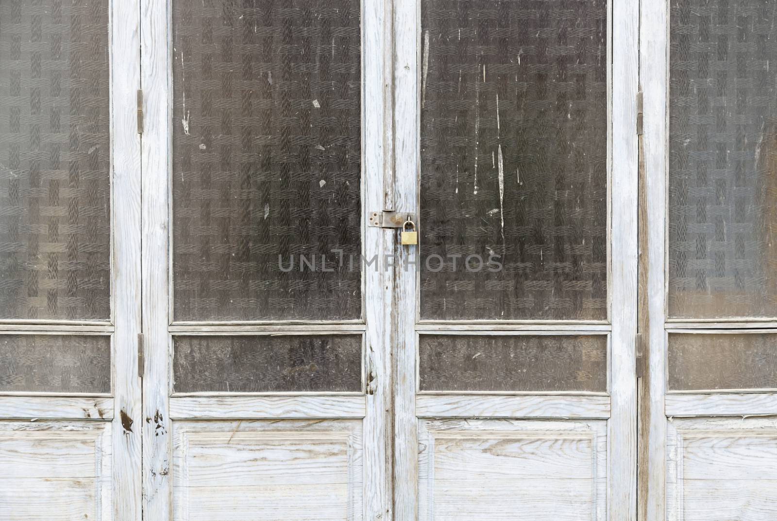 Old wooden windows, a detail windows closed and abandoned, ruin and abandonment