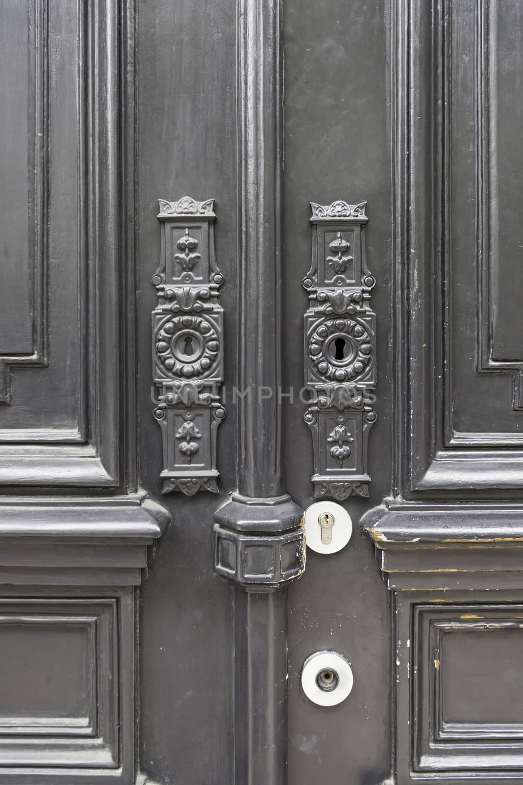Old door decorated, detail of a typical Lisbon door, security protection and decoration