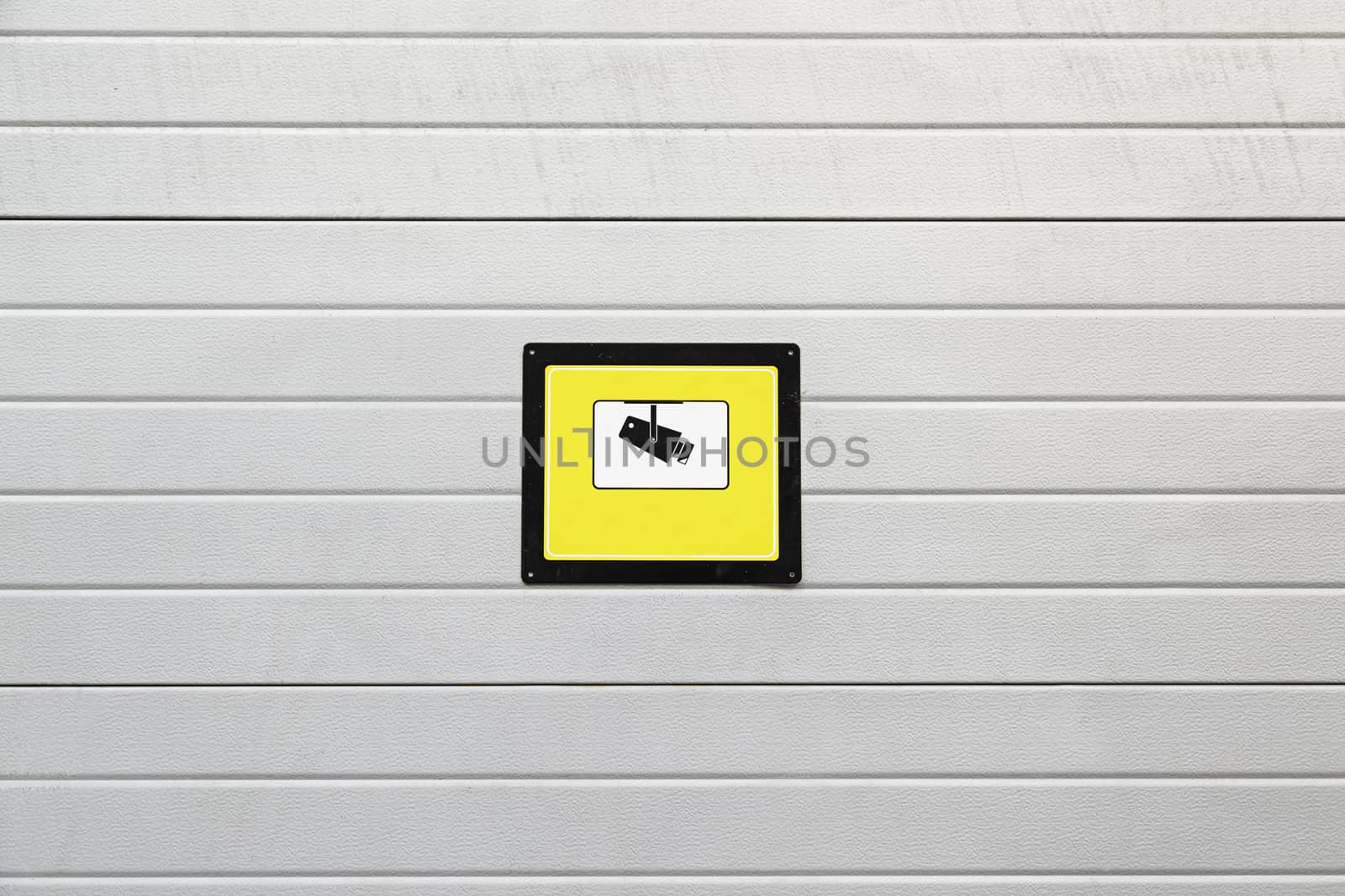 Signal surveillance camera, detail of a wall with a plate of surveillance information in the city
