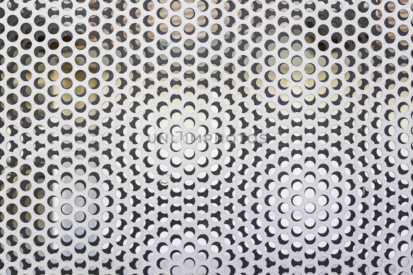 Perforated metal railing, detail of a metal wall protection, safety and toughness