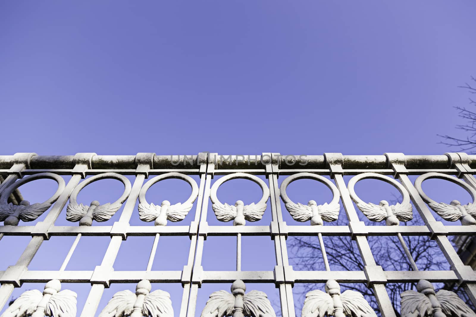 White metal railing, detail of a guardrail and decoration, exterior and sky