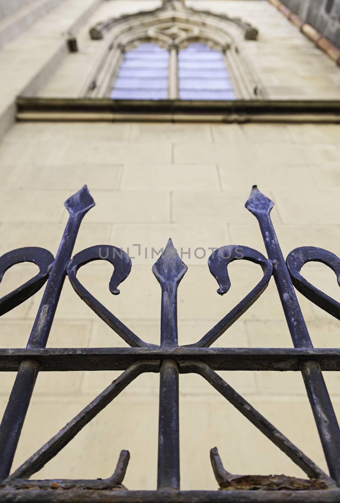 Metal railing on a church, detail of a metal shield on a facade, art and Safety