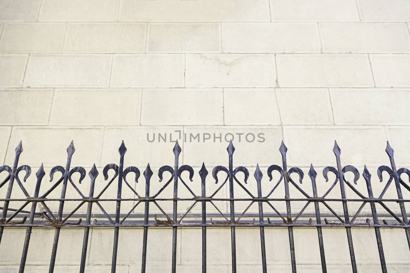 Metal railing on a church, detail of a metal shield on a facade, art and Safety