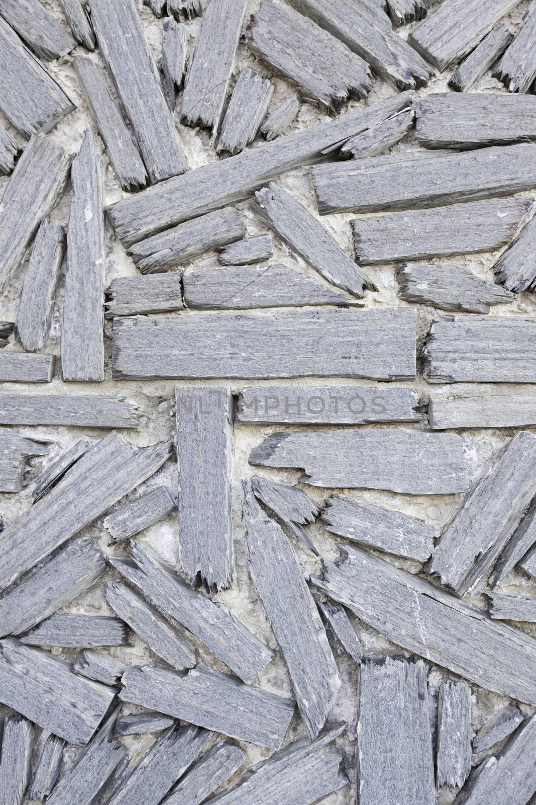 Wall stone texture, detail of a wall decorated with stone, decoration and safety facade in the city