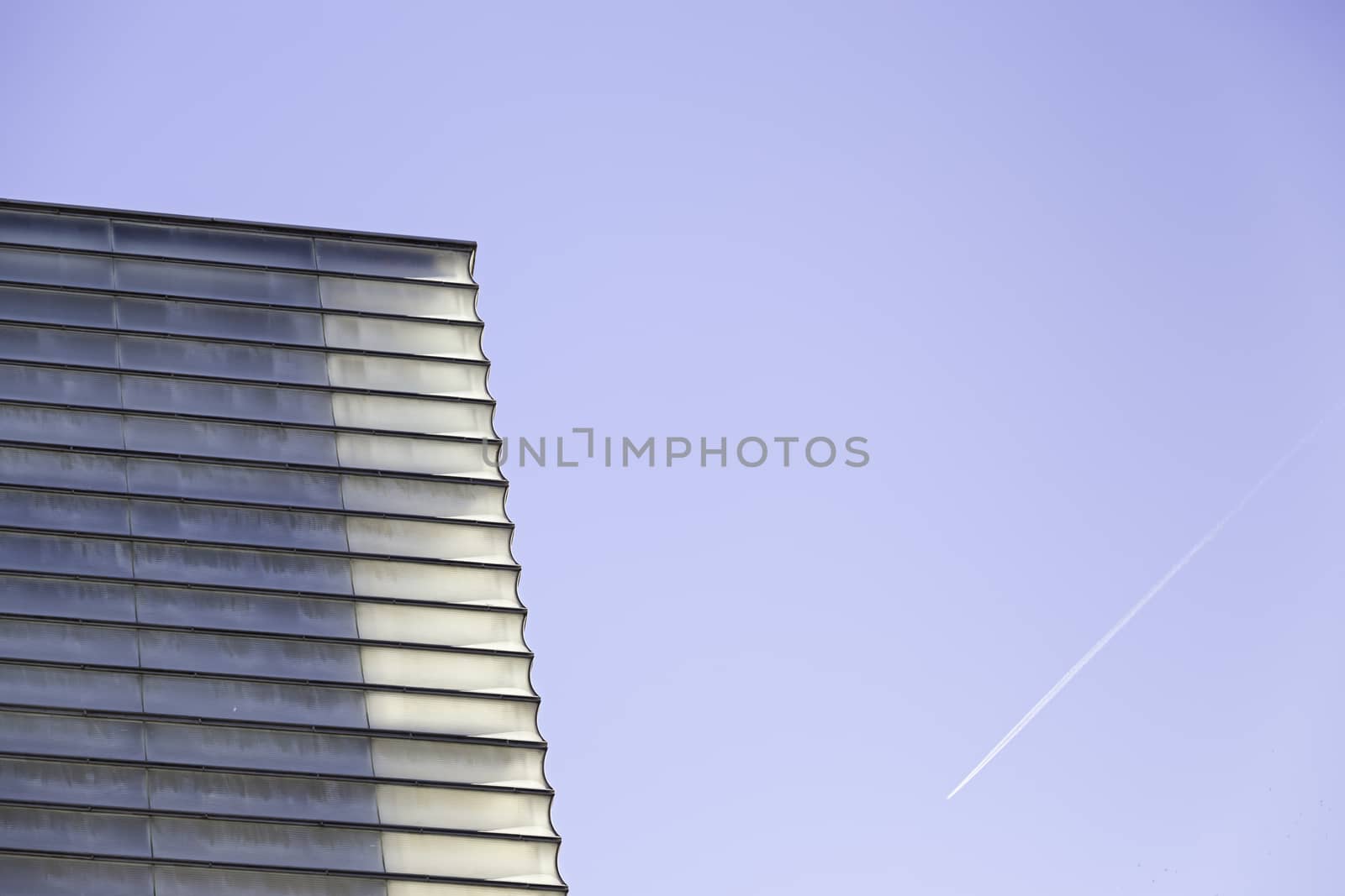 Modern windowed building, detail of a facade in the city, modern architecture