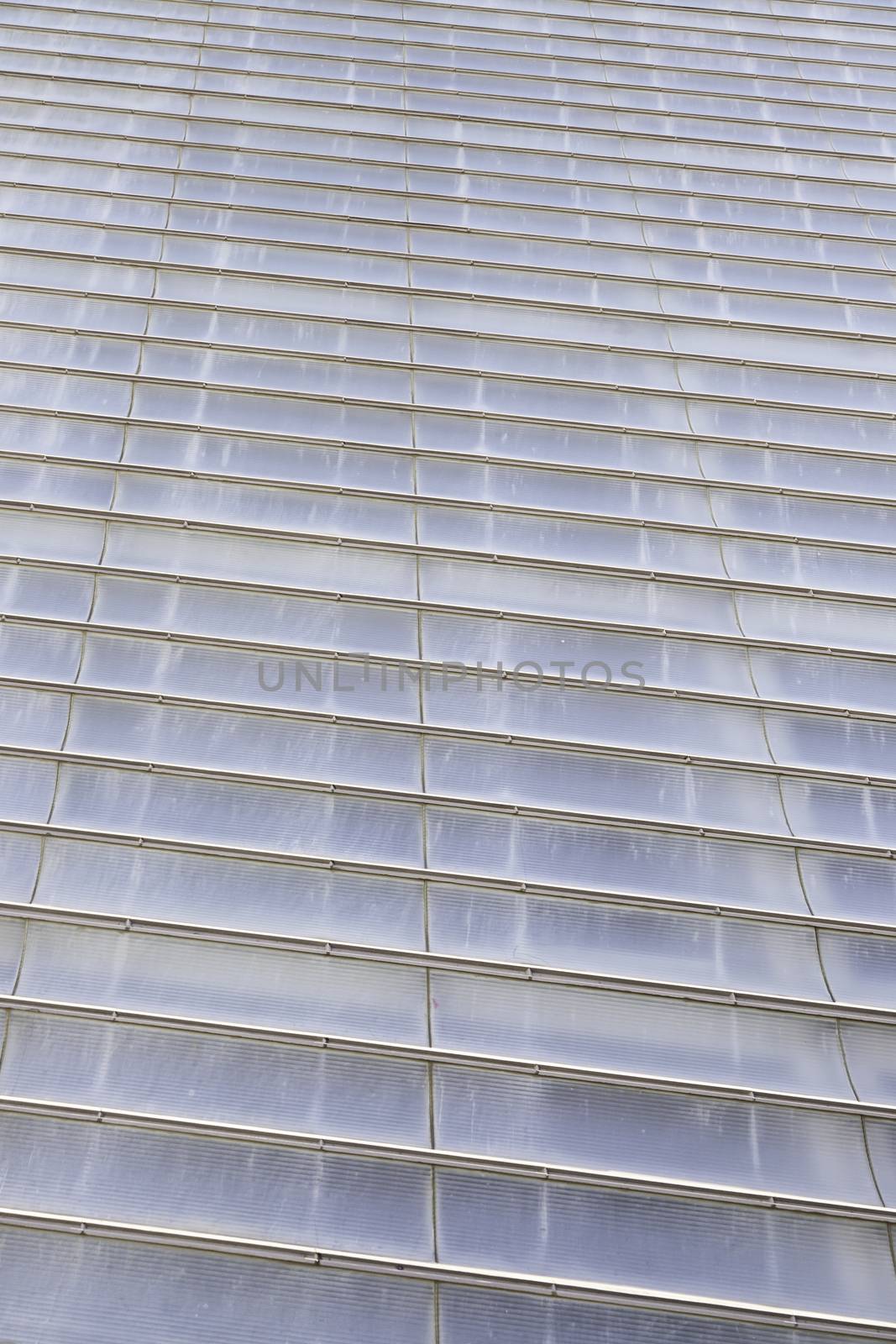 Clear plastic facade, detail of a facade covered in the city, decoration and protection