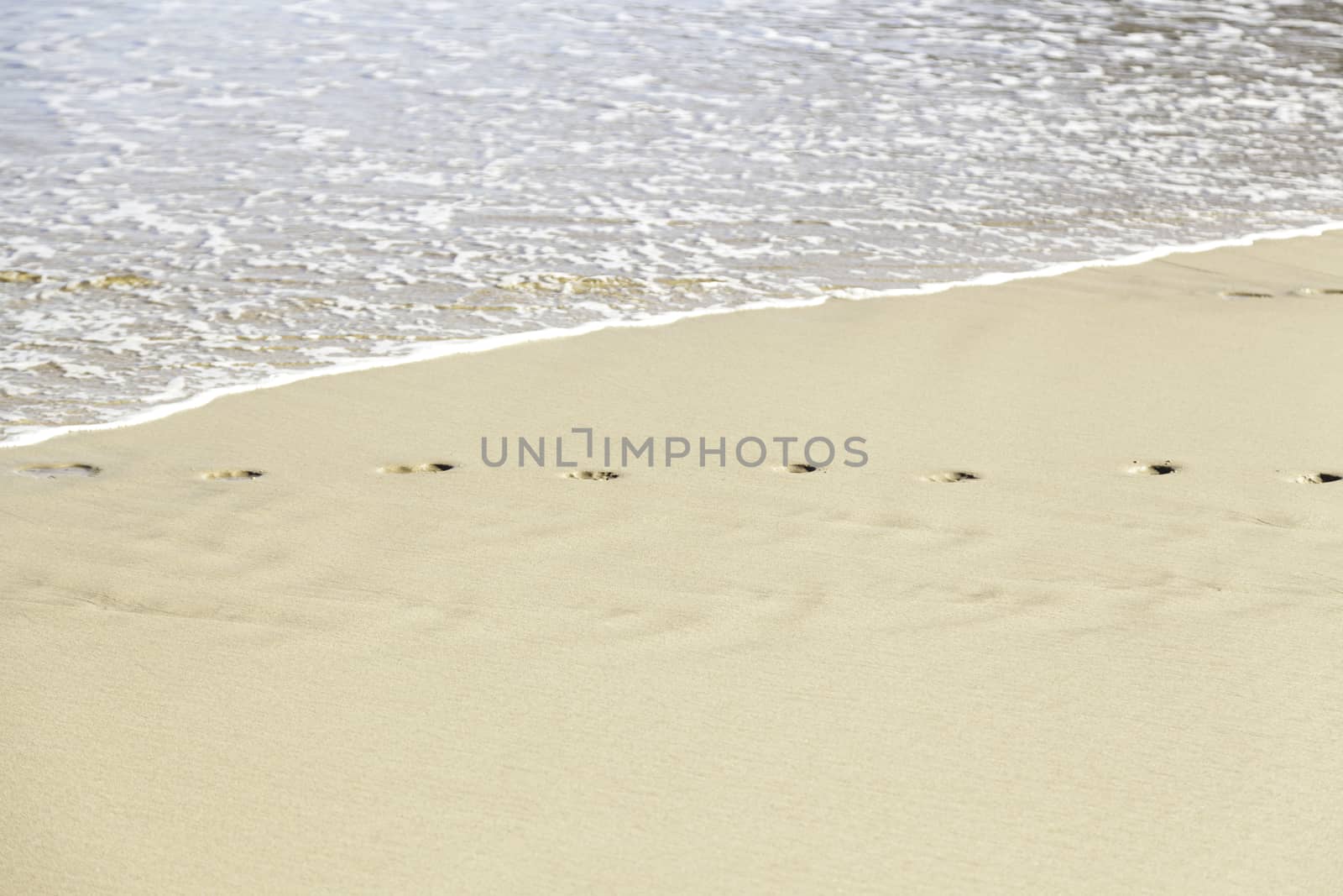 Footprint in the sand on the beach, detail signal marked in the sand, sea sand
