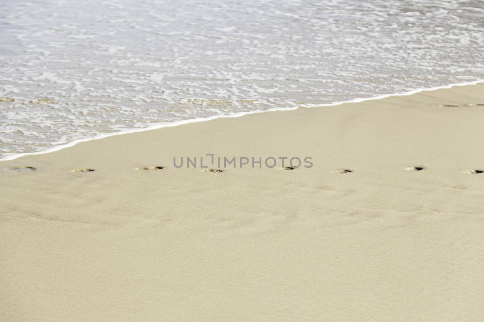 Footprint in the sand on the beach, detail signal marked in the sand, sea sand