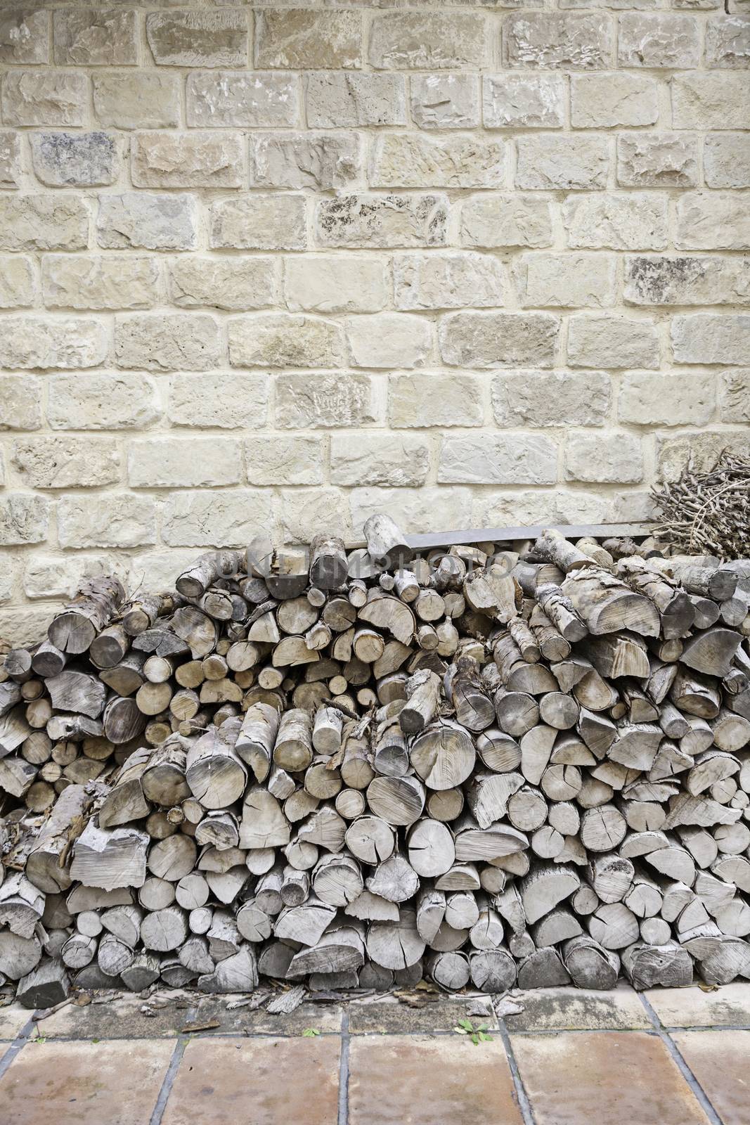 Firewood cut into a house, detail of a mountain of wood to burn and heat the house, traditional heating