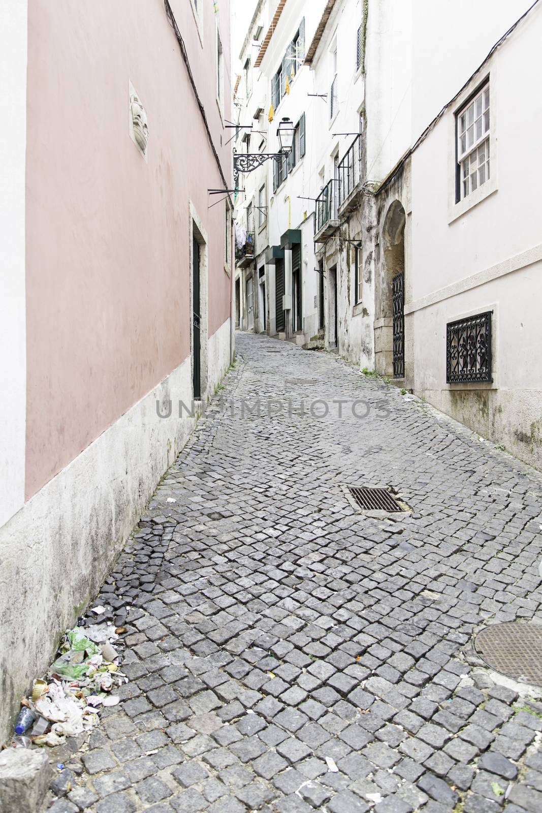 Old and historic alley in Lisbon, detail of an old street in the historical district, tourism in Portugal