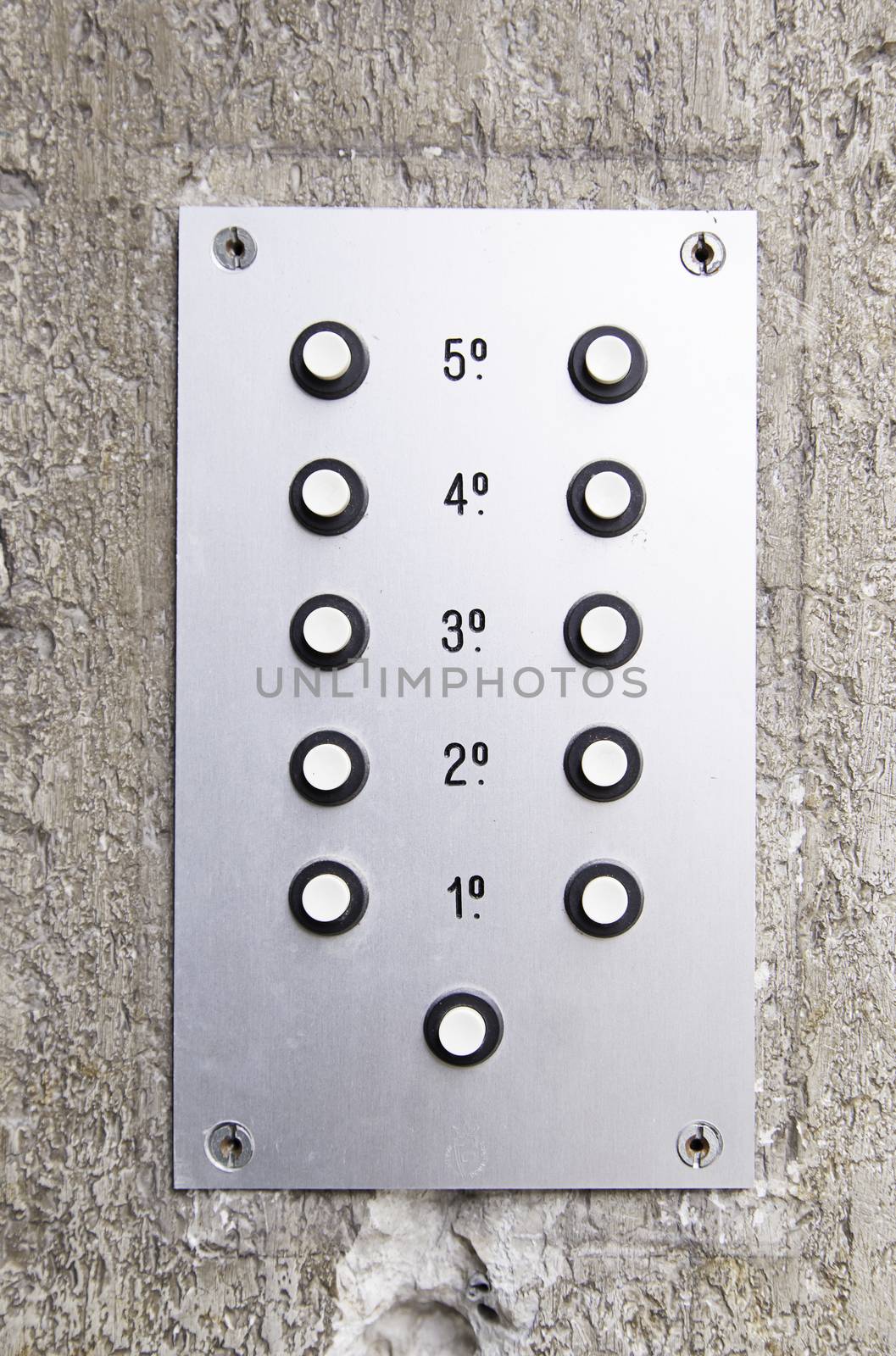 Old intercom, detail of an old communication device in a building of houses