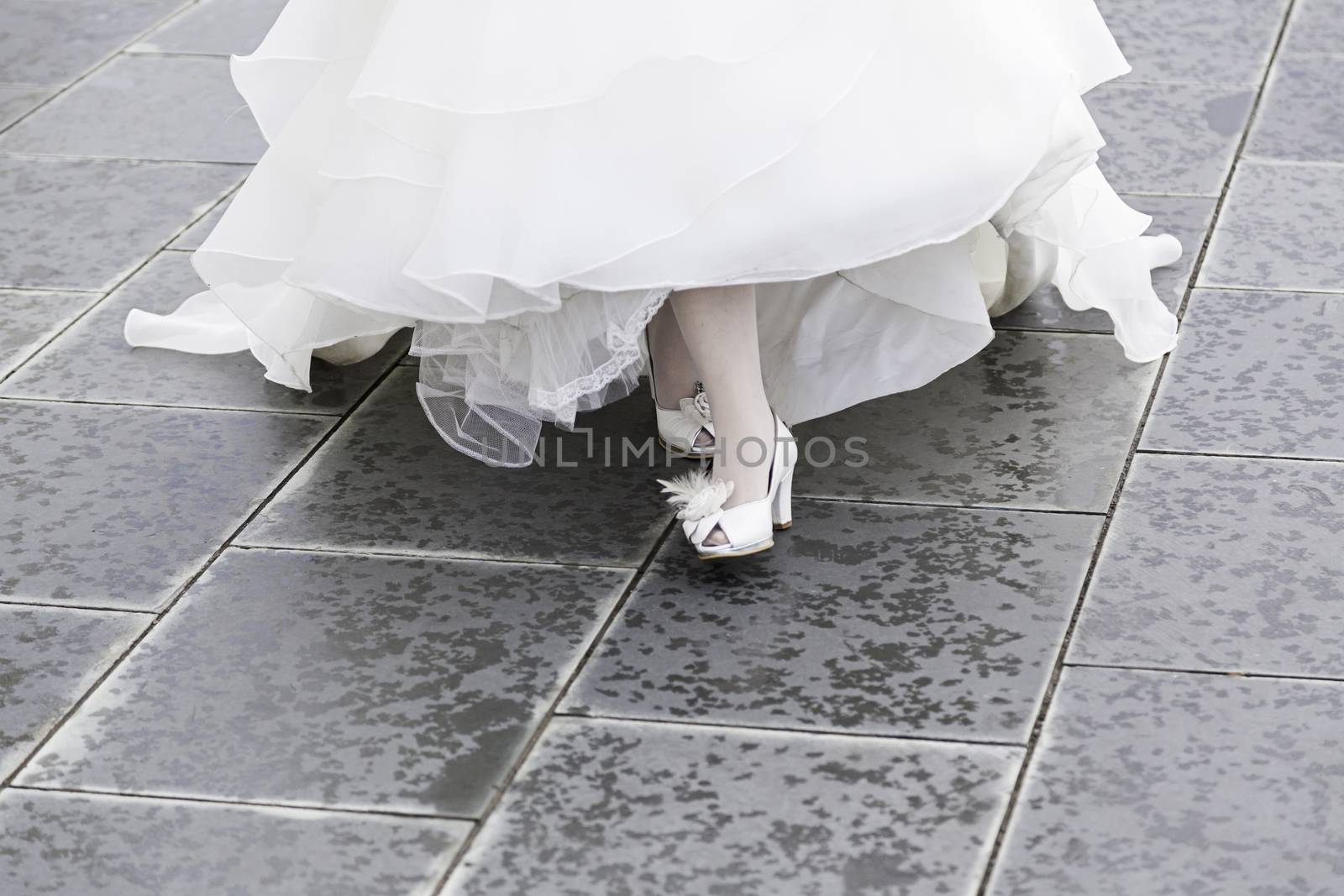 White bridal shoes at a wedding, detail of shoes for a wedding ceremony, love and fashion