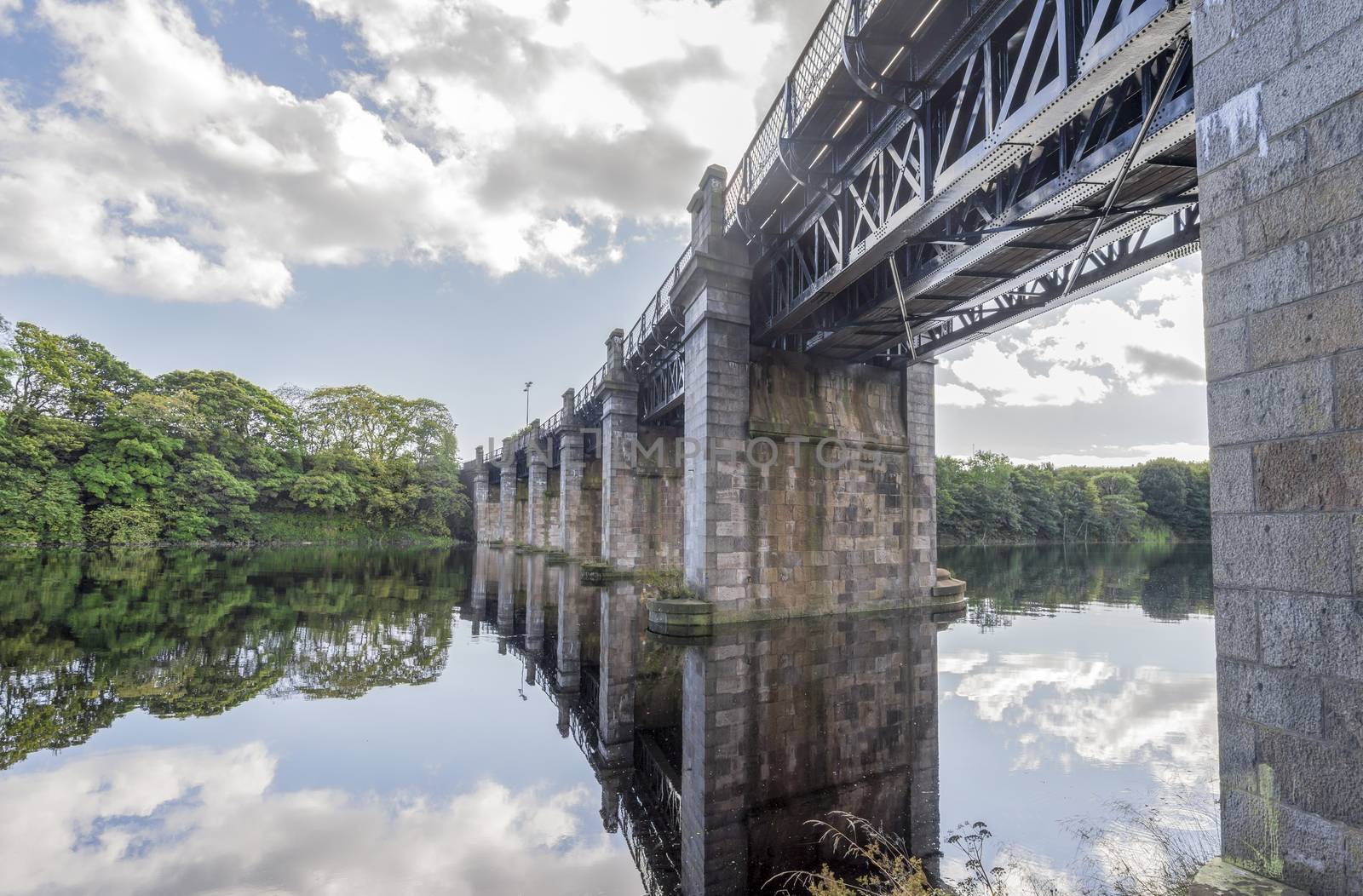 A view of scenic railway bridge across river Dee in Aberdeen, Scotland by anastasstyles