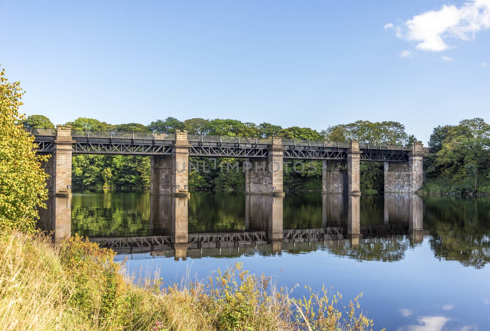 A scenic view of a bridge across river Dee near Duthie park, Aberdeen, Scotland