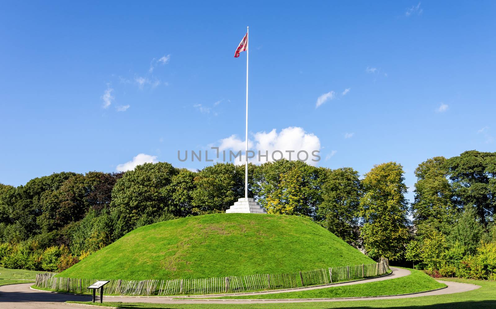 A tall flagpole on top of the Mound in Duthie park, Aberdeen, Scotland by anastasstyles