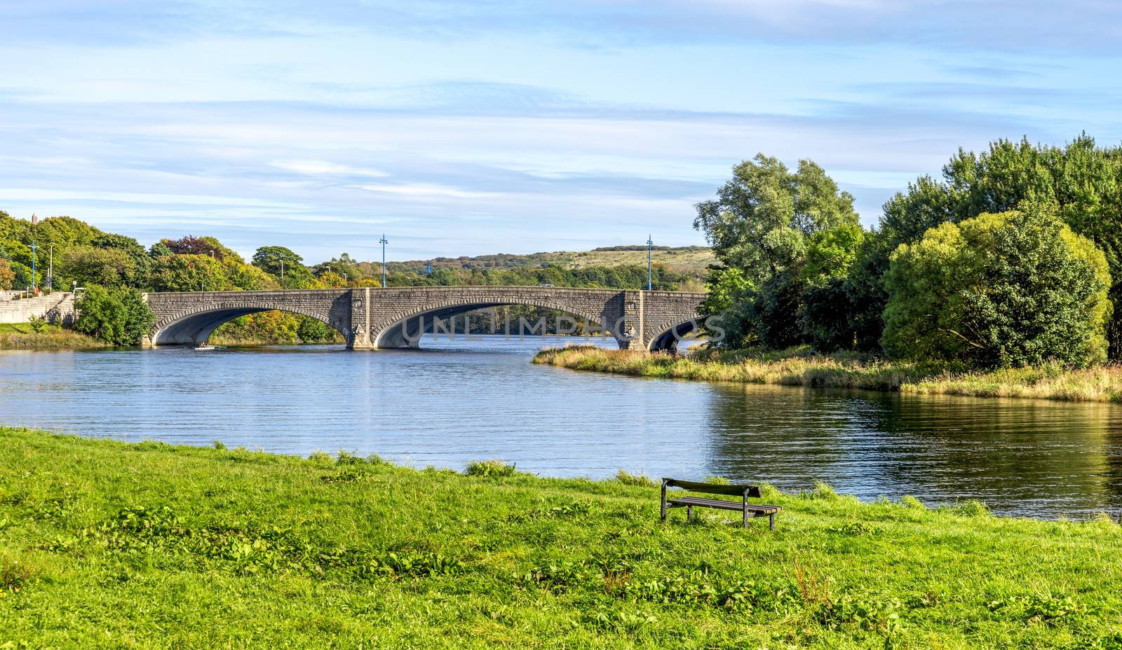 A scenic view of am ached bridge and river Dee in a beautiful sunny day, Aberdeen, Scotland