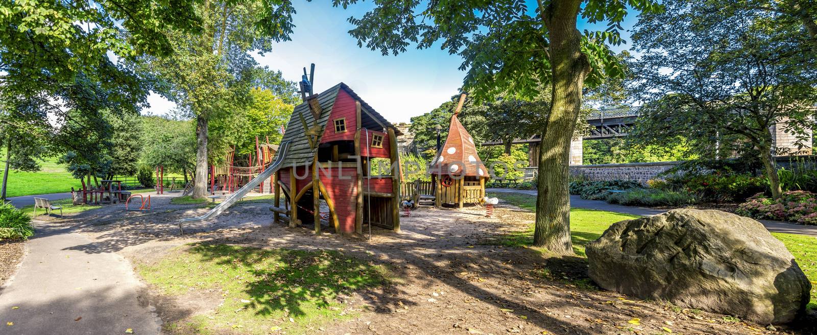 Panoramic view of wooden playground with magic houses and slides, Duthie park, Aberdeen, Scotland by anastasstyles