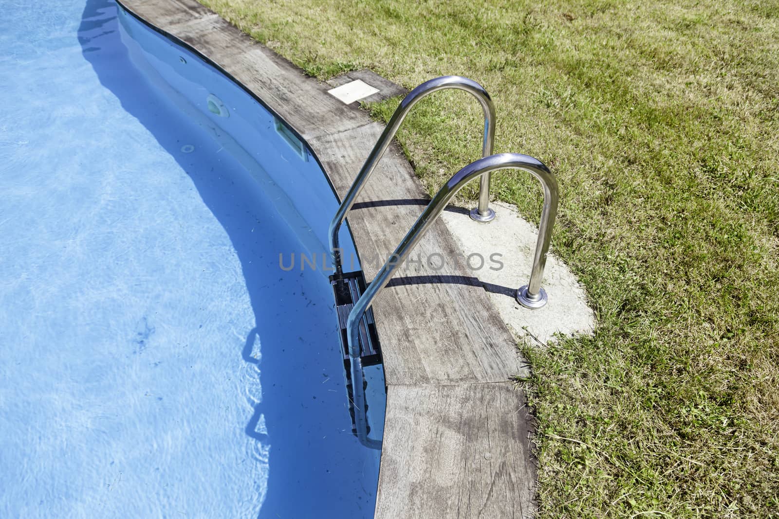Swimming and railing, detail of a summer swimming pool, sport and fun, August