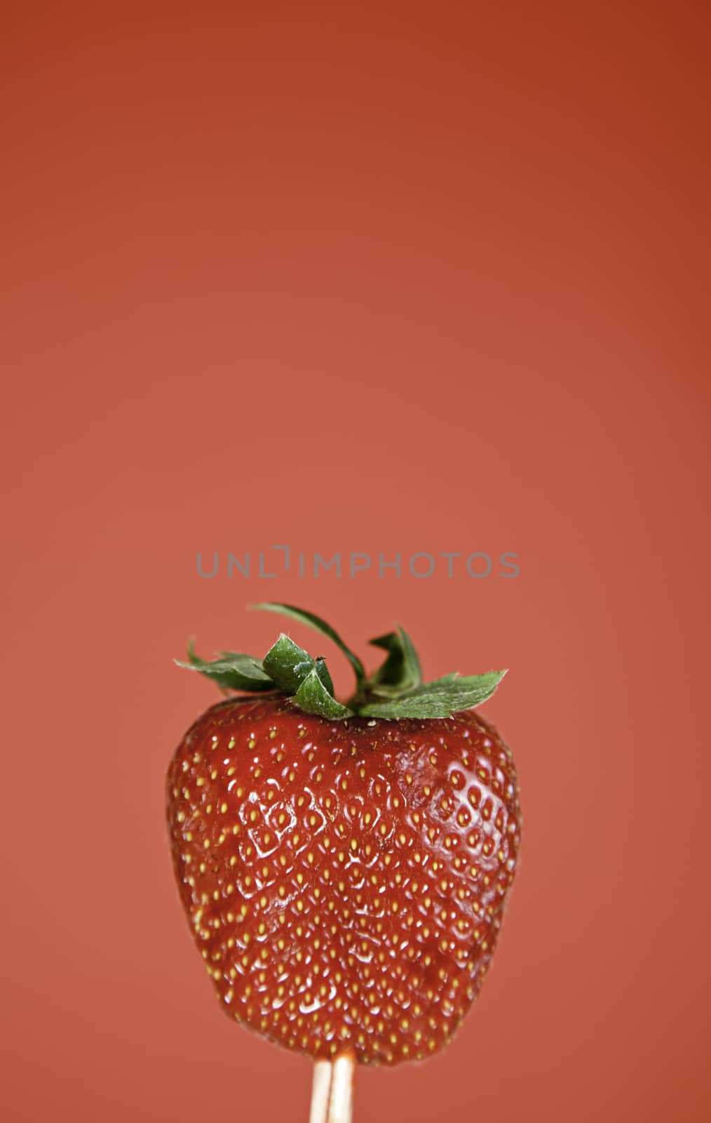 Strawberries on red background, detail of a sweet and juicy strawberry, food healthy life, diet,