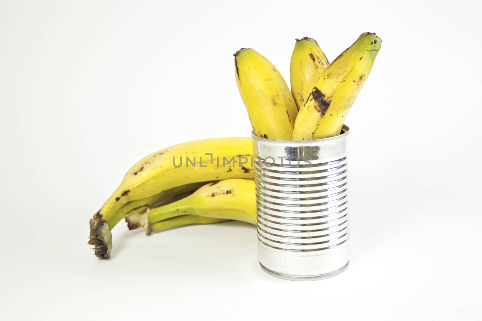 Bananas and canned fruit detail preserved in a can, food healthy, diet
