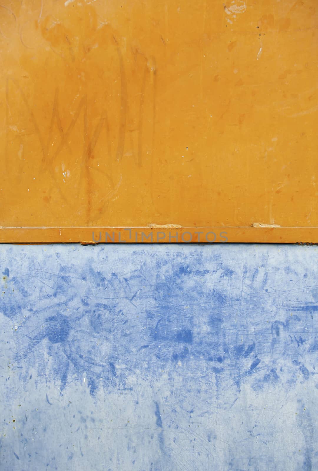 Wall colors, detail of a wall painted colors, orange and blue textured background