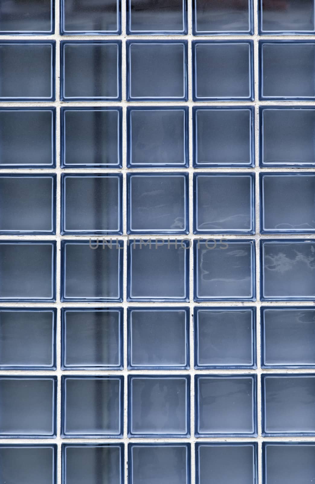 Blue glass wall, detail of a blue wall transparent glass brick house