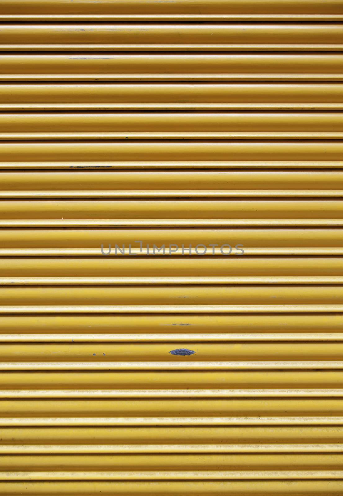 Yellow protective grille, protective detail element in the city, closed