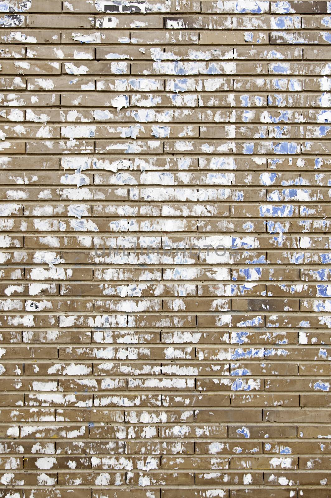Stained brick wall, detail of a brick wall paper stained
