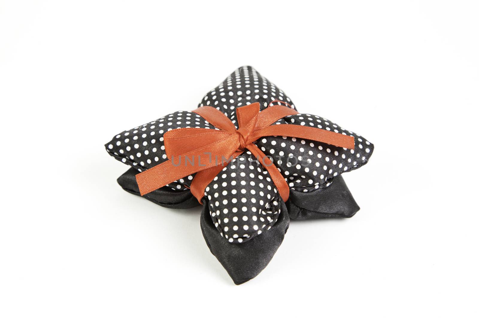 Gift with ribbon detail of a package wrapped with a bow, holiday or celebration detail