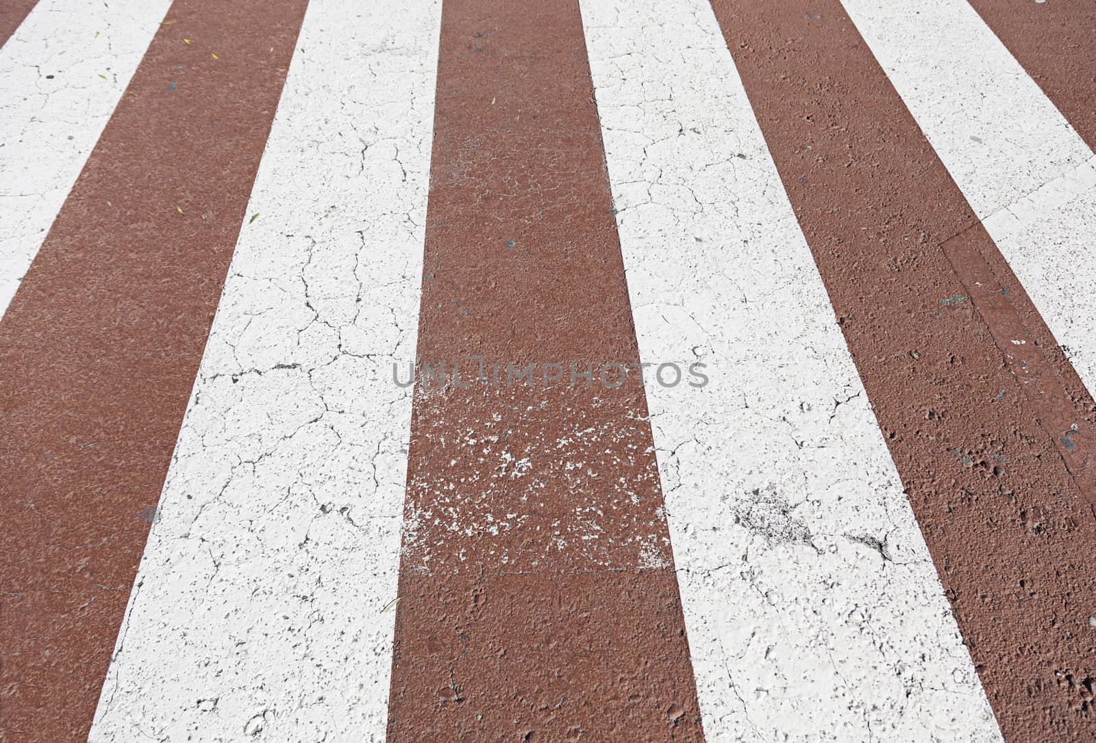 Zebra crossing red and white, detail of a pedestrian circulation signal, protection and security