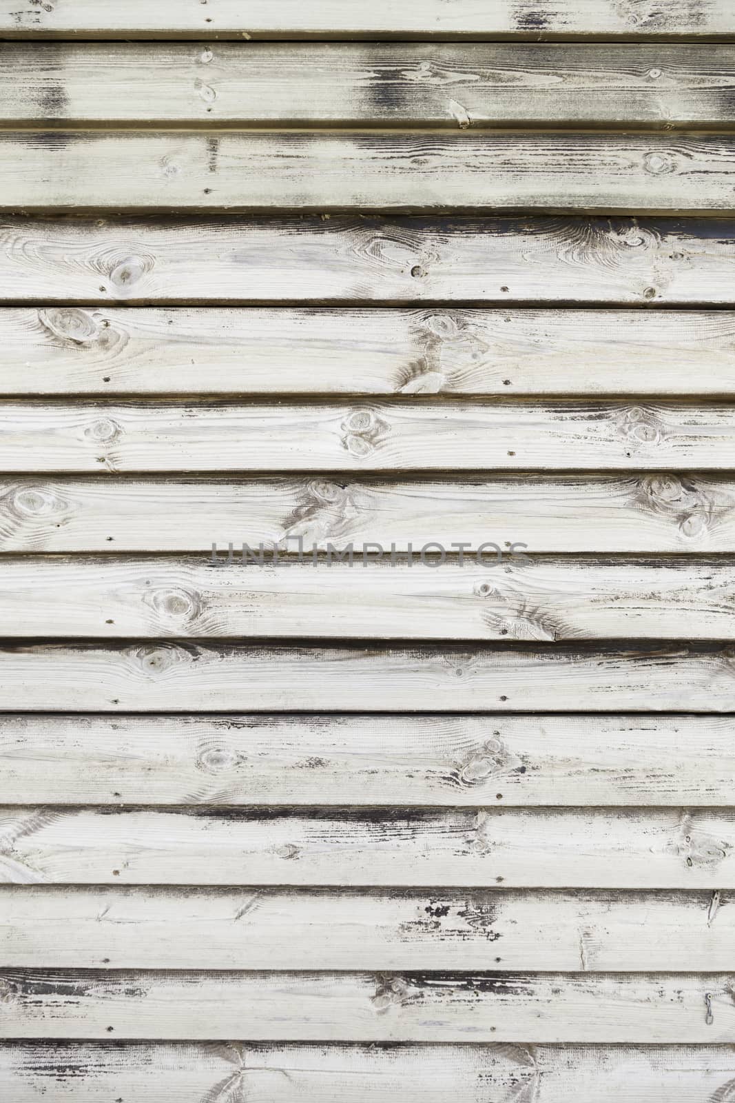 Wooden slats, detail of a wall decorated with wood in the city, wooden textured background