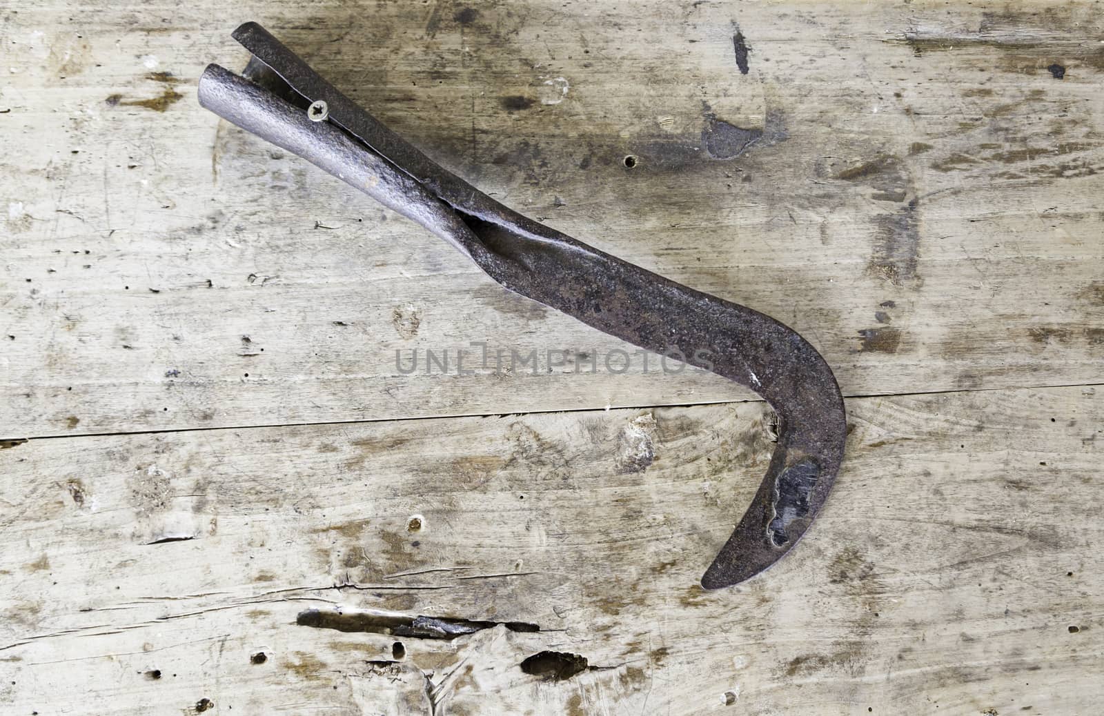 Old rusty scythe, detail of a classic tool to cut wheat and herbs