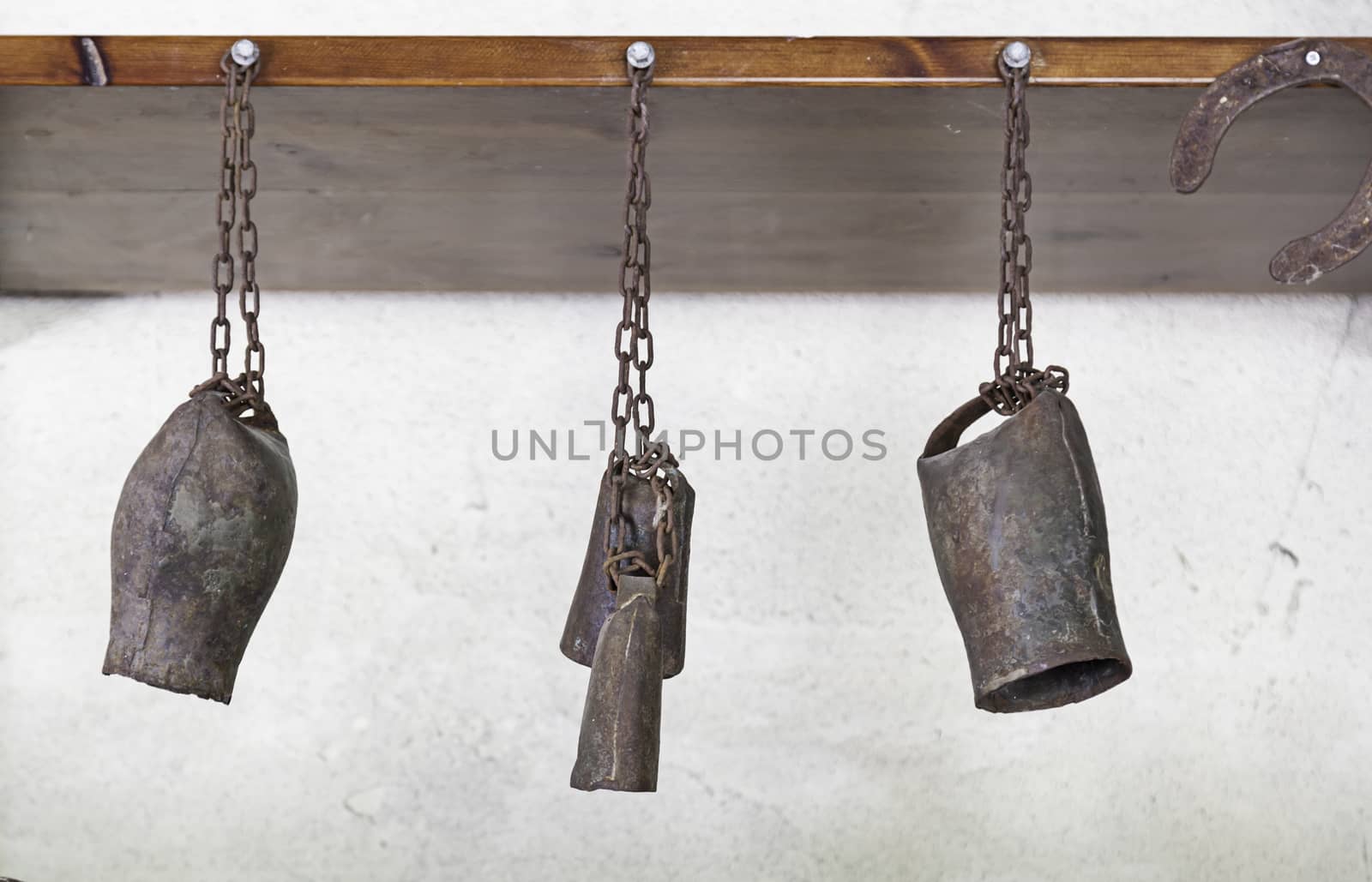 Old rusty bells, tools for farm animals, old abandoned