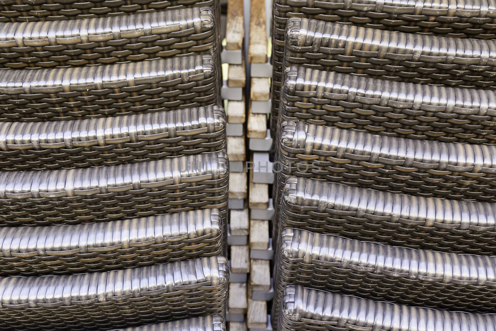 Chairs with woven fibers, textures and detail of a few resistant materials and hard