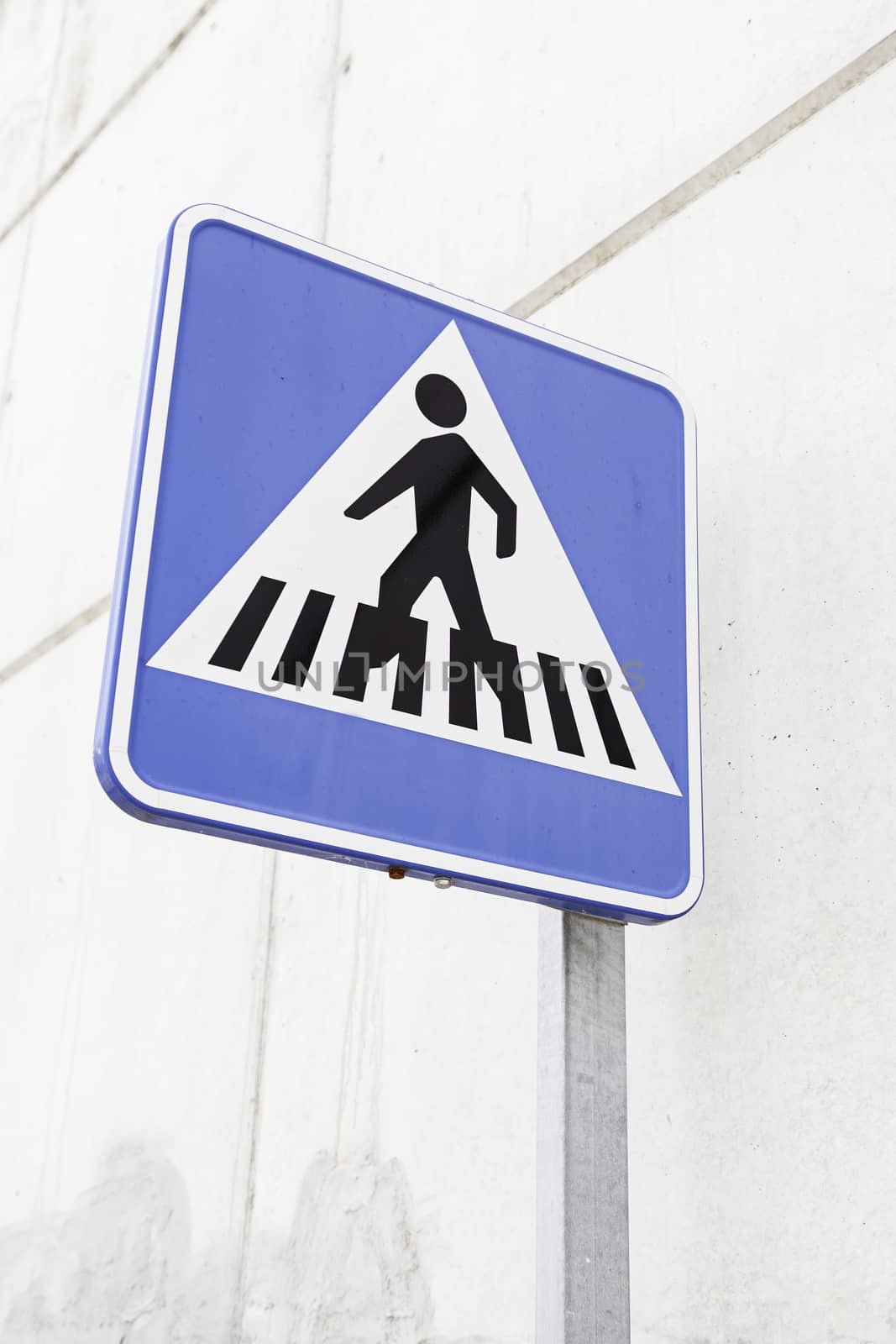 Sign of a zebra crossing, detail of an information signal on the street, caution and information
