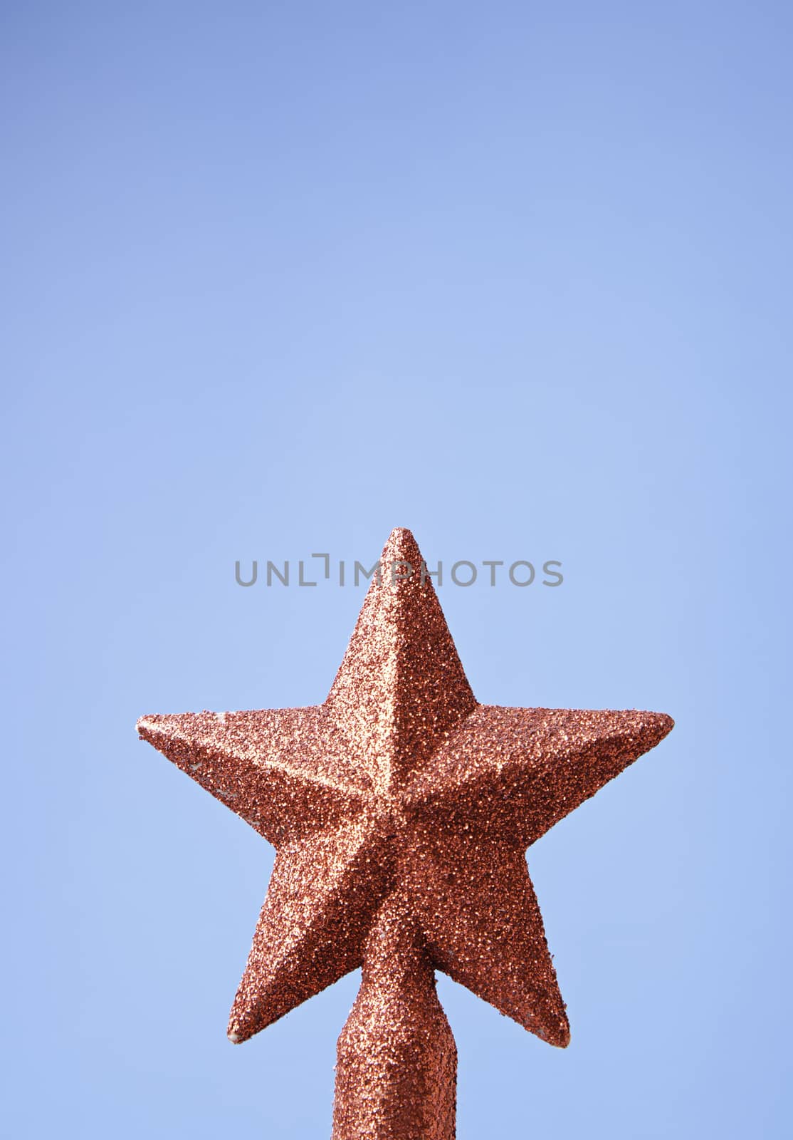 Christmas star on the tree, detail of Christmas decoration, celebration and happiness