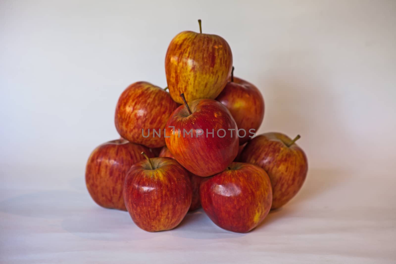 Still life image of stacked red Starking apples.