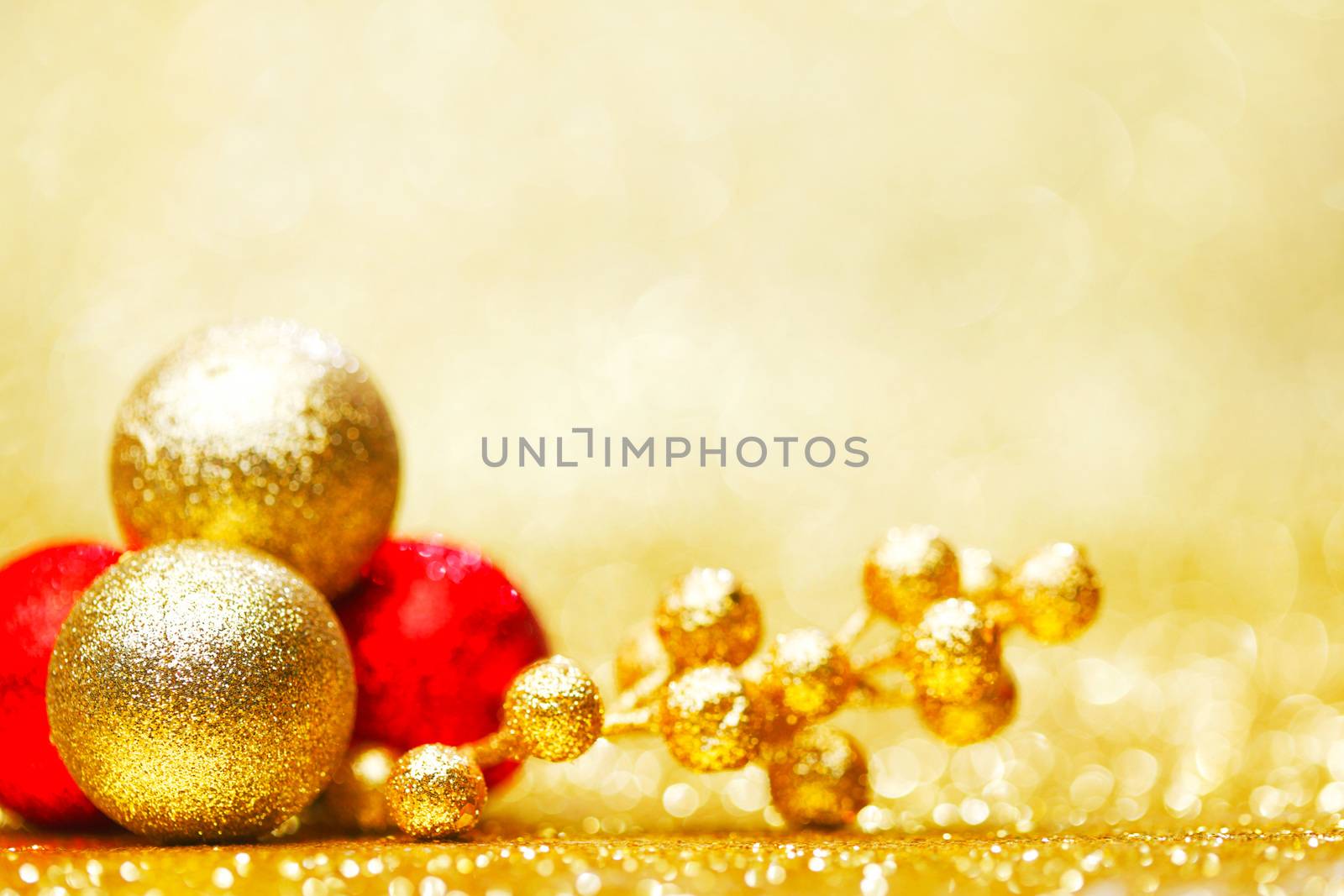 Colorful christmas decoration on shiny golden background