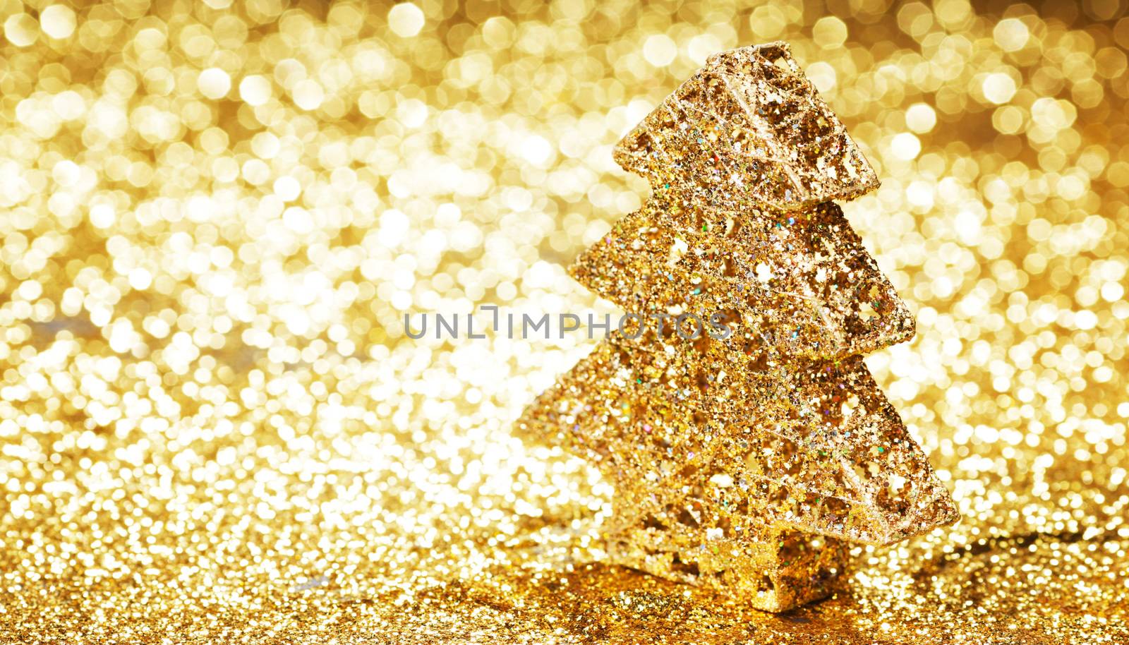 Decorative golden toy christmas tree and gifts
