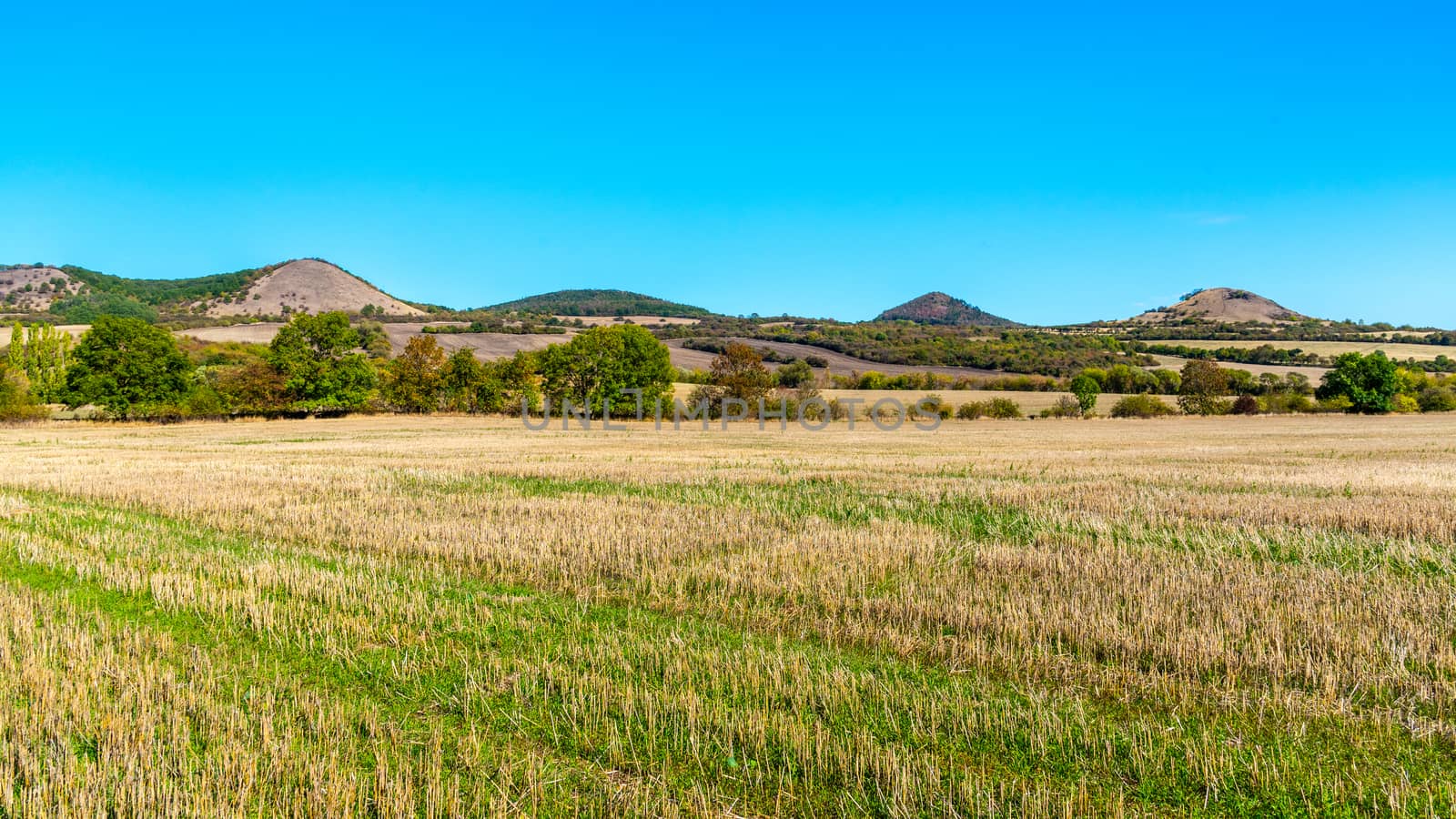 Landscape of Ceske Stredohori, aka Central Bohemian Highlands, with typical spiky hills of volcanic origin, Czech Republic.