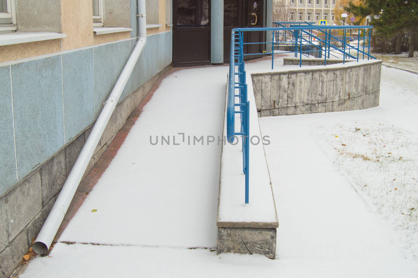 The ramp is covered with the first snow installed for the movement of people with disabilities at any time of the year by claire_lucia