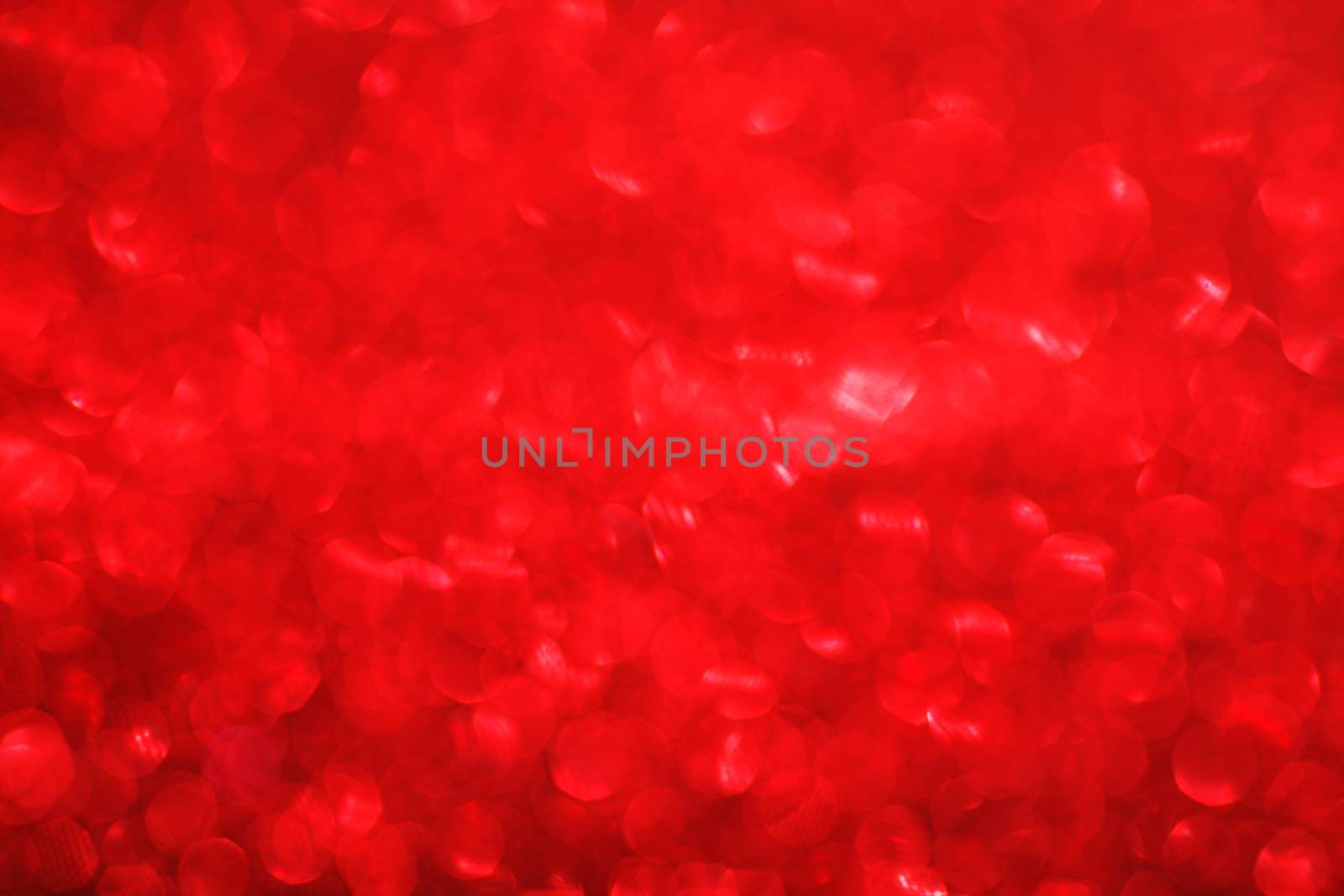 Red bokeh holiday textured glitter background